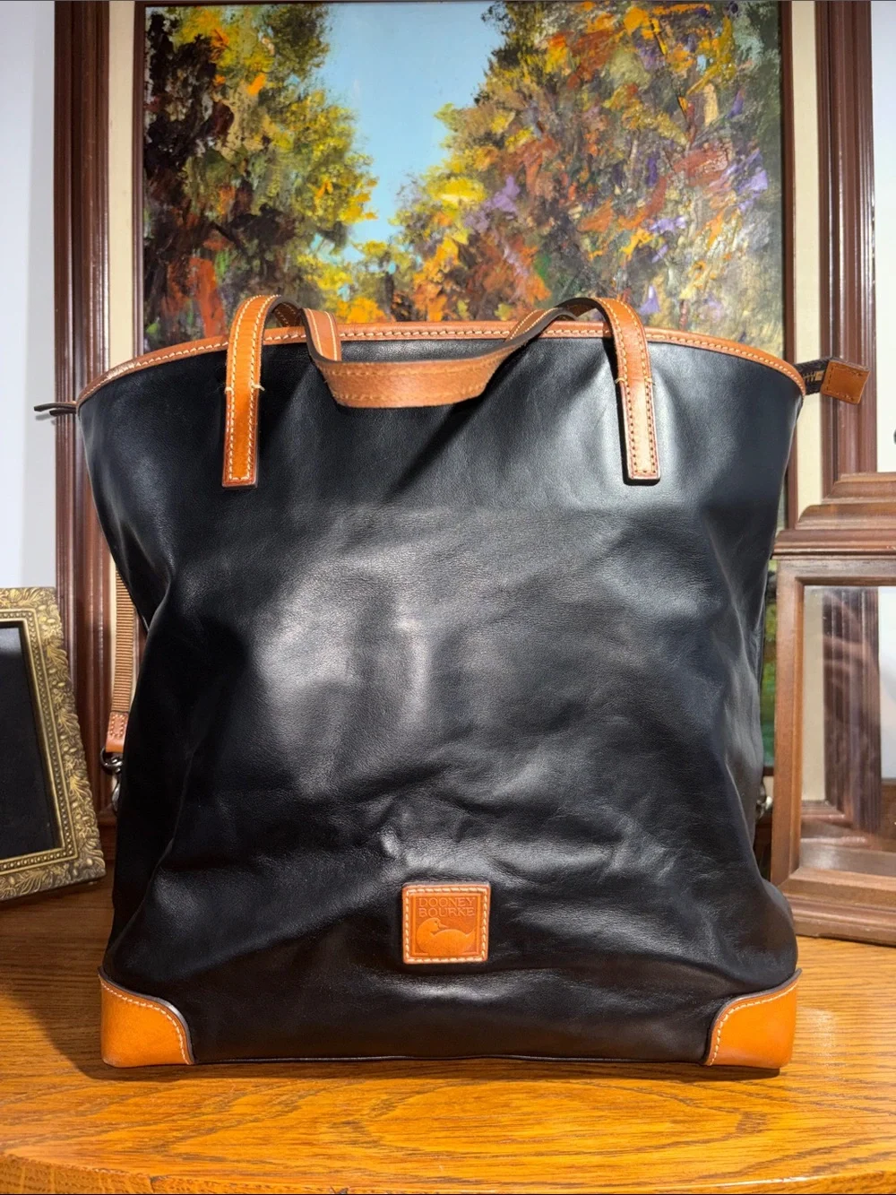 Dooney & Bourke Black Leather Tote with Tan Trim and Handles